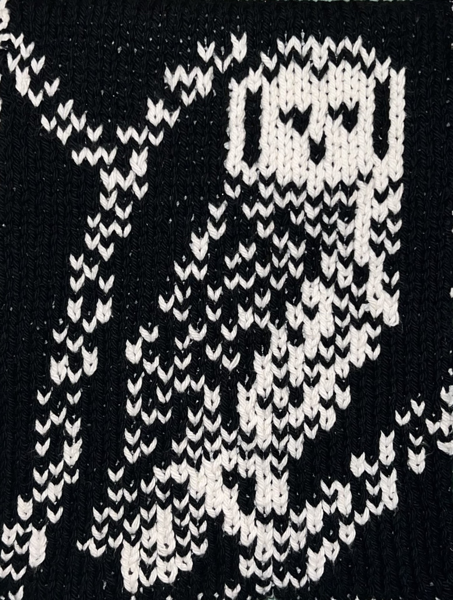 This pattern contains instructions on how to make a double-knit hand/ dish towel. The final product measures approximately 8 1/2” (22cm) by 25” (63.5 cm) and is reversible. The design is knit from a chart and contains basic instructions. It is knit using US 6 (4 1/4 mm) needles and 1 ball of Lily Sugar’n Cream cotton yarn in black and 1 ball of Lily Sugar’n Cream cotton yarn in white or other worsted weight yarn.